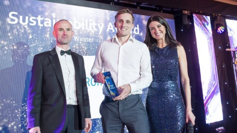 Environment Bank's Fraser Rutherford receiving an award on behalf of the company
