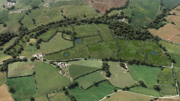 Birds-eye render of Harrogate Habitat Bank with habitats restored, including new meadows, trees, scrub, grassland, native hedgerow, broadleaved woodland, and ponds.