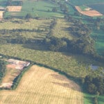Birds-eye render of Wymondham Habitat Bank with habitats restored, including new orchards, meadows, scrub, grassland, ponds, and broadleaved woodland