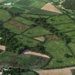 Birds-eye render of Chippenham Habitat Bank with habitats restored, including new meadows, hedgerow, trees, ditches, ponds, rivers, scrub, culvert, and broadleaved woodland