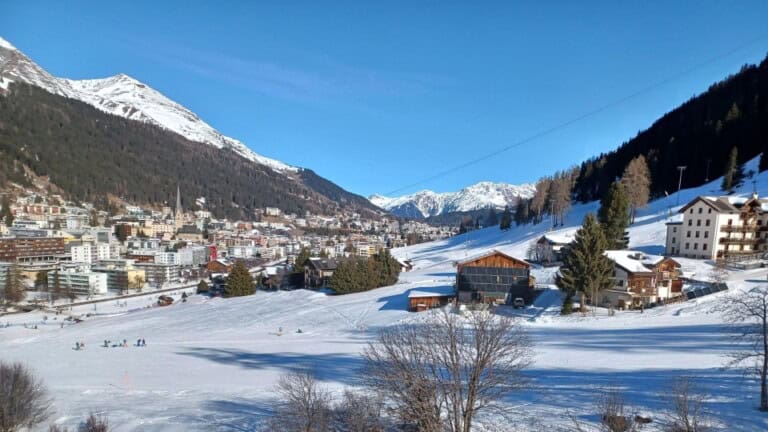 Ski slopes beside the town of Davos, Switzerland with snowy mountains in the background