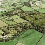Birds-eye render of Cockermouth Habitat Bank with habitats restored, including new meadows, ponds, trees, scrub, and woodland