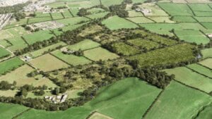 Birds-eye render of Cockermouth Habitat Bank with habitats restored, including new meadows, ponds, trees, scrub, and woodland