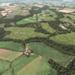 Birds-eye render of Cockermouth Habitat Bank with habitats restored, including new meadows, ponds, scrub, lowland heath, grassland, and woodland