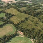 Birds-eye render of Chiddingfold Habitat Bank with habitats restored, including new meadows, scrub, grassland, hedgerows, and woodland