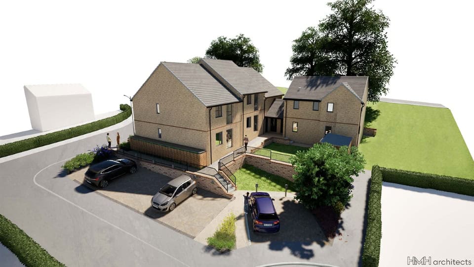 Render looking down on Karbon Homes new development showing new properties with vehicles parked around and grass and trees surrounding