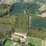 Birds-eye render of Dereham Habitat Bank with habitats restored, including new meadows, scrub, orchards, ponds, ditches, trees, grassland, and woodland