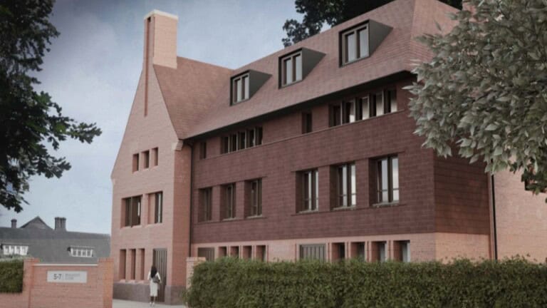 Vision of new housing complex as seen from the street, with trees and hedges surrounding