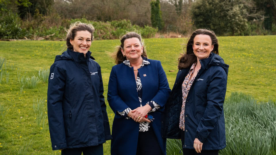Jess (right) with Environment Bank's ecologist Annie Green, the landowner from Mawgan Habitat Bank