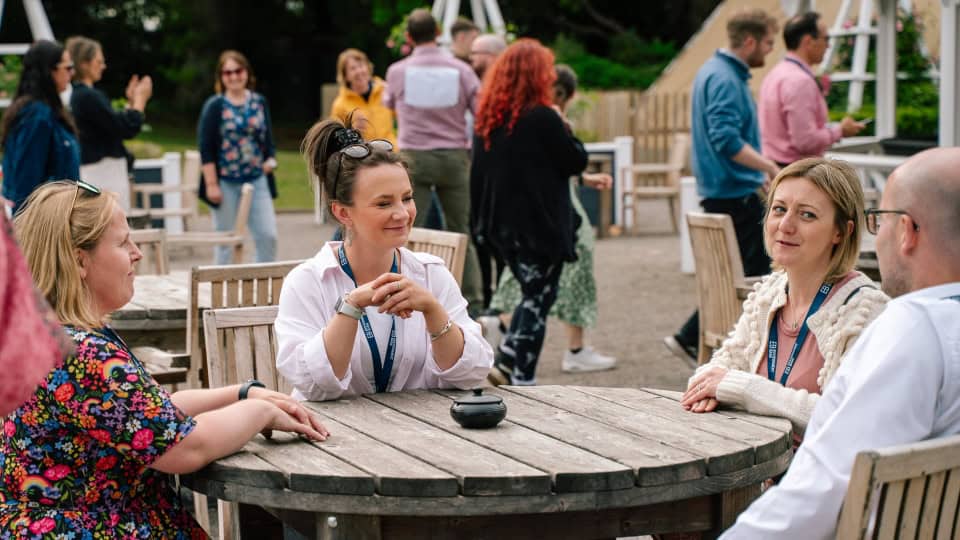 Members of the team sat together at Environment Bank's 2025 Summer Meet
