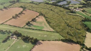Birds-eye render of Marston Meysey Habitat Bank with habitats restored, including ponds, hedgerow, ditches, grassland, and trees